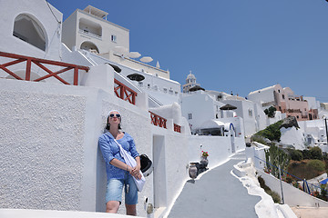 Image showing Greek woman on the streets of Oia, Santorini, Greece