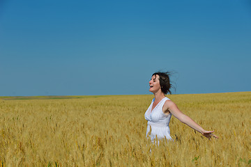 Image showing young woman in wheat field at summer