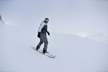 Image showing skiing on fresh snow at winter season at beautiful sunny day