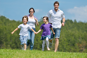 Image showing happy young family have fun outdoors