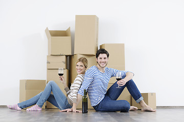 Image showing Young couple moving in new home