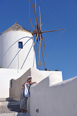 Image showing Greek woman on the streets of Oia, Santorini, Greece