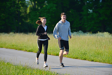 Image showing Young couple jogging