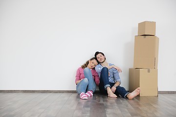 Image showing Young couple moving in new home