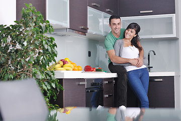 Image showing young couple have fun in modern kitchen