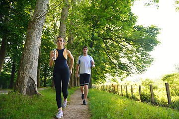 Image showing Young couple jogging