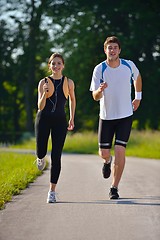 Image showing Young couple jogging