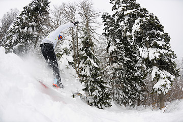 Image showing snowboarder on fresh deep snow