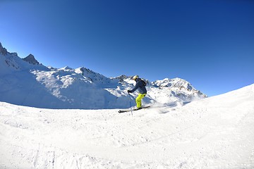 Image showing skiing on fresh snow at winter season at beautiful sunny day