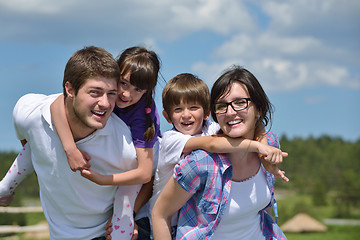 Image showing happy young family have fun outdoors