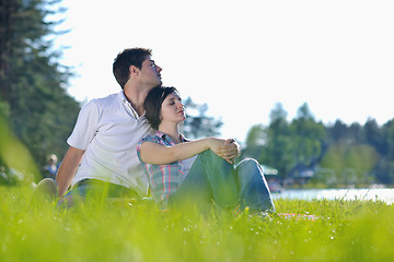 Image showing happy young couple having a picnic outdoor