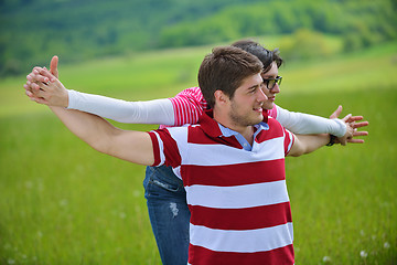 Image showing Portrait of romantic young couple smiling together outdoor