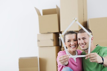 Image showing Young couple moving in new home