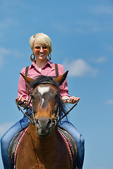 Image showing happy woman  on  horse