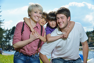 Image showing happy young family have fun outdoors