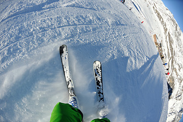 Image showing skiing on fresh snow at winter season at beautiful sunny day