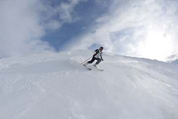 Image showing skiing on fresh snow at winter season at beautiful sunny day