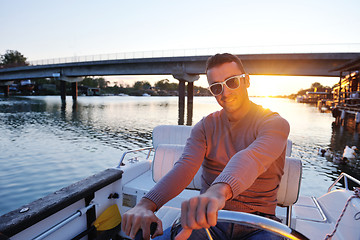 Image showing portrait of happy young man on boat