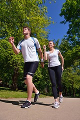 Image showing Young couple jogging at morning