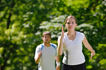 Image showing Young couple jogging