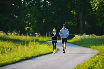 Image showing Young couple jogging