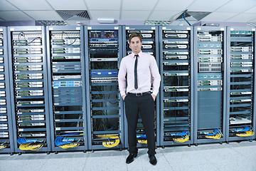 Image showing young it engeneer in datacenter server room