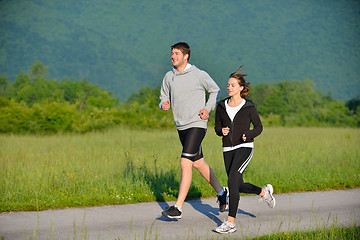 Image showing Young couple jogging