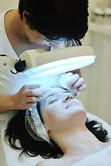 Image showing woman with facial mask in cosmetic studio