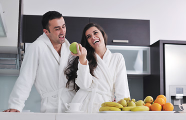 Image showing young couple have fun in modern kitchen