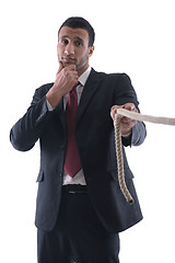 Image showing business man with rope isolated on white background