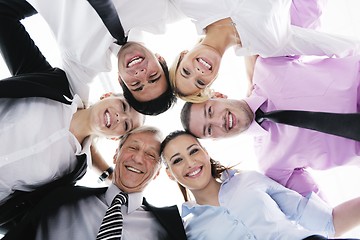 Image showing business people with their heads together