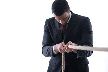 Image showing business man with rope isolated on white background