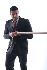 Image showing business man with rope isolated on white background