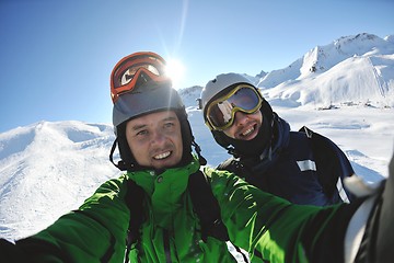 Image showing winter portrait of friends at skiing