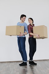 Image showing Young couple moving in new home