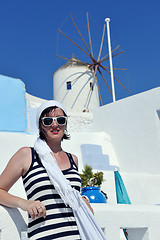 Image showing Greek woman on the streets of Oia, Santorini, Greece