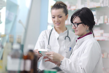 Image showing team of pharmacist chemist woman  in pharmacy drugstore