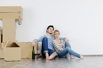 Image showing Young couple moving in new house