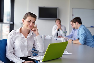 Image showing business woman with her staff in background at office