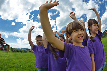 Image showing happy kids group  have fun in nature