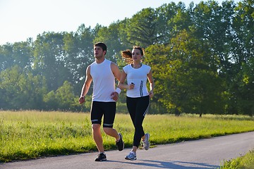 Image showing Young couple jogging