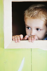 Image showing happy child in a window