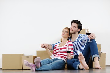 Image showing Young couple moving in new house