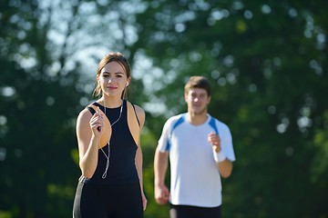 Image showing Young couple jogging at morning