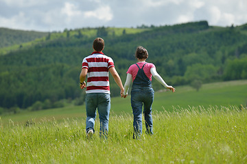 Image showing Portrait of romantic young couple smiling together outdoor