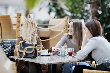 Image showing cute smiling women drinking a coffee