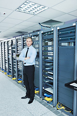 Image showing young it engeneer in datacenter server room