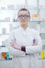 Image showing pharmacist chemist woman standing in pharmacy drugstore