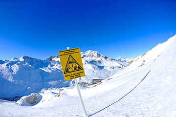 Image showing Sign board at High mountains under snow in the winter