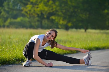 Image showing woman stretching before fitness